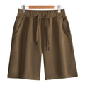 Straight-leg cotton shorts for summer in grey, shown on a hanger.