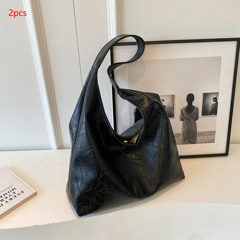 Soft leather shoulder bag with sandwich pocket exterior in multiple colour options