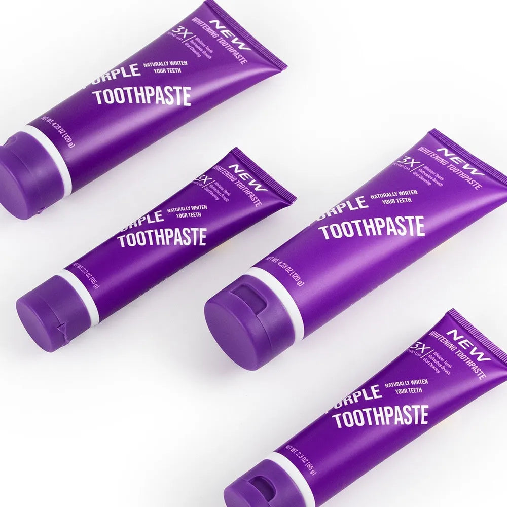 Purple whitening toothpaste tube for adults in 120g and 65g sizes with fluoride formula