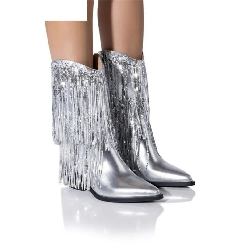 Women's black chunky heel ankle boots with tassel detail and pointed toe on a stiletto heel.