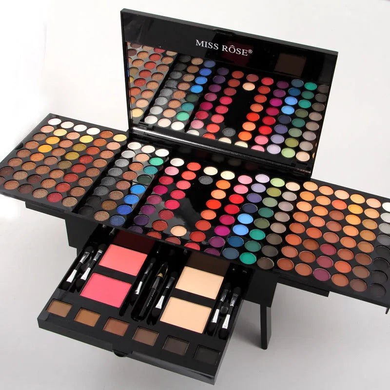 Piano-shaped makeup palette open to show 190 colour pans including eyeshadows, blushes, and powders.
