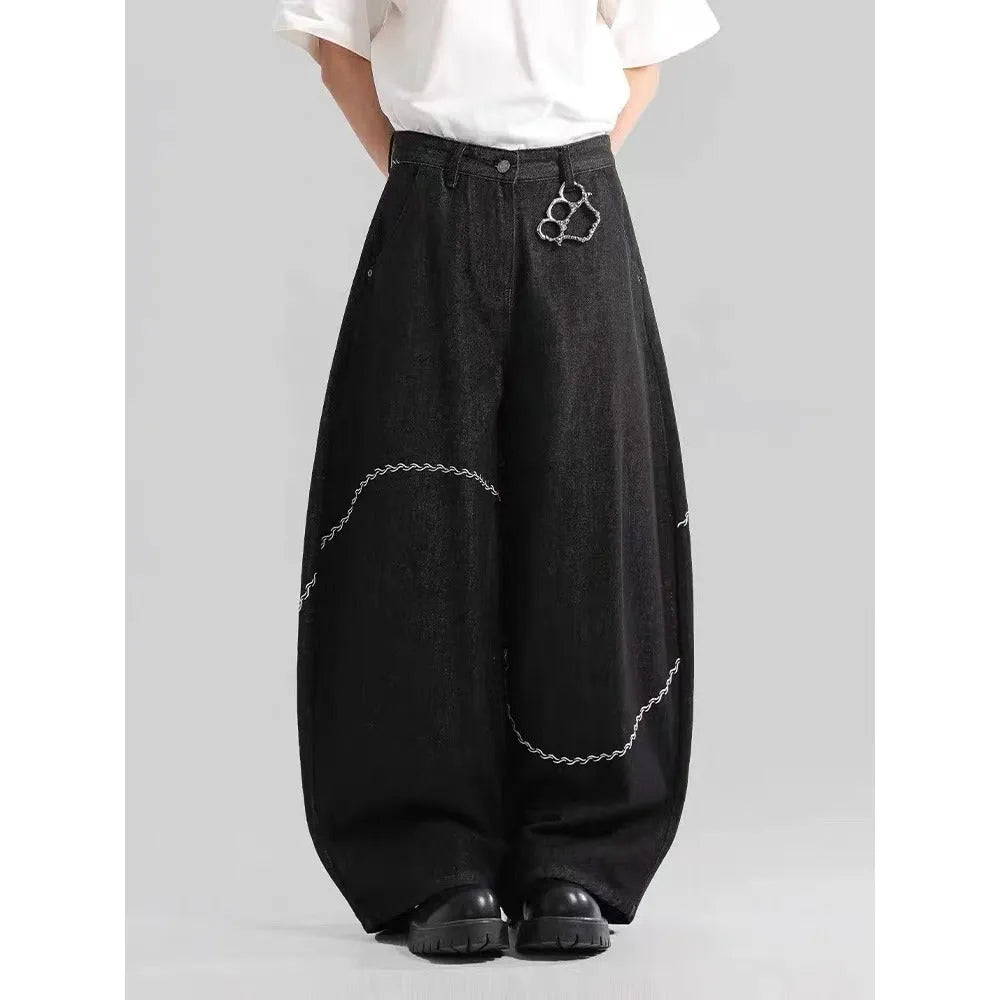 Black straight-leg denim trousers with micro-elastic waist and zip fly closure