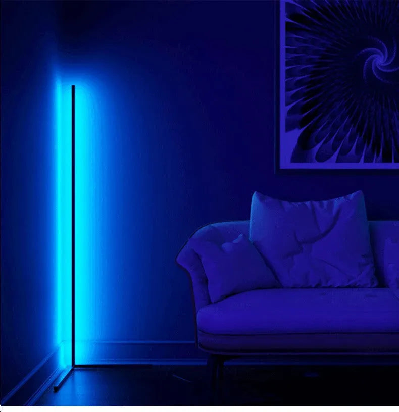 Nordic RGB corner floor lamp with aluminium shade, PVC body, remote control, 1.42m height, black finish against a light wall