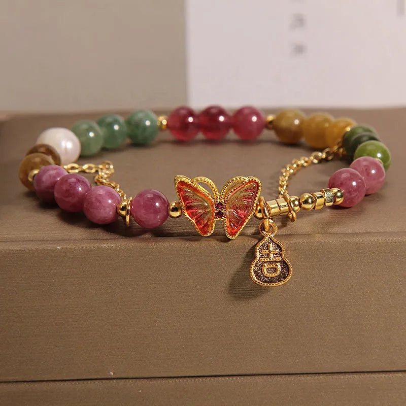 Natural jade coloured agate bracelet with butterfly and gourd pendant.