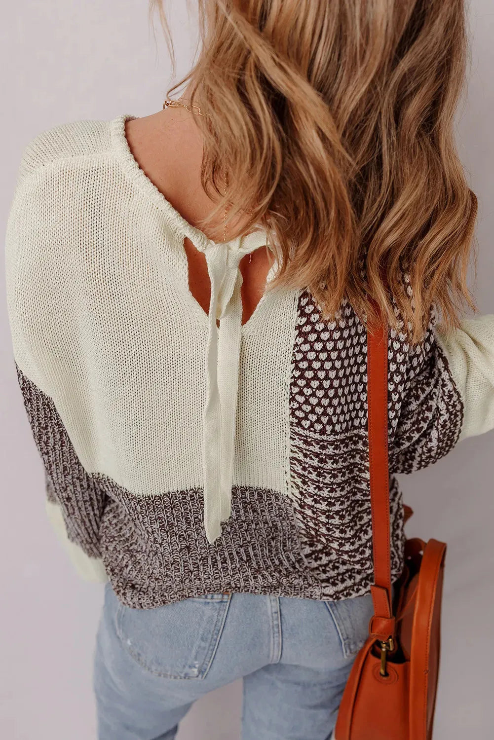 Dark khaki drop shoulder loose sweater with colour block design and a back tie.