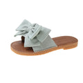 Women's slip-on suede sandals with bow detail in beige, light green, and pink colour options