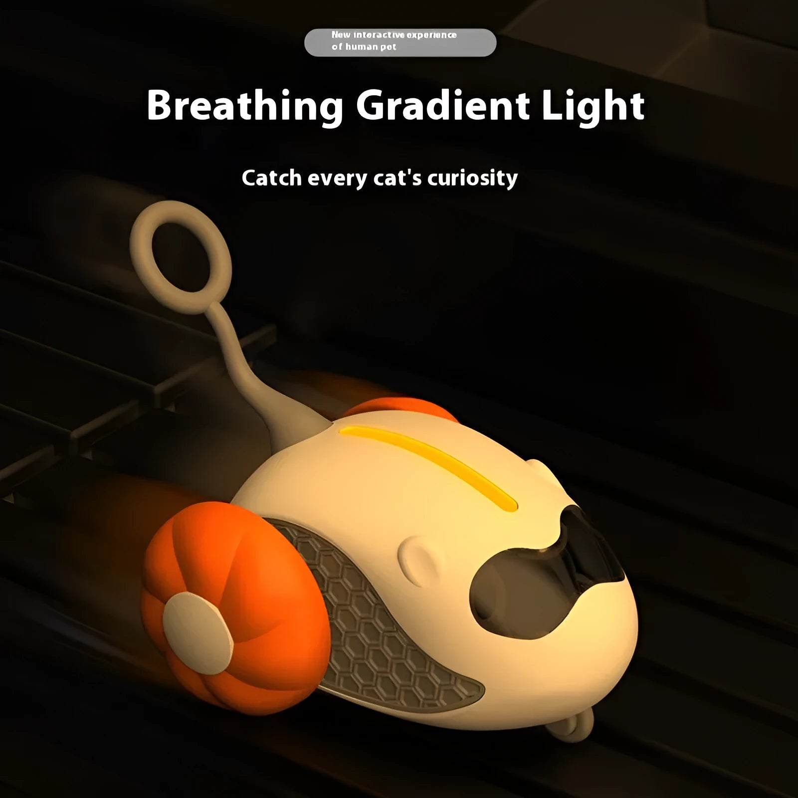 Charging Cat Teaser remote control toy with feather attachment in orange plastic body on floor