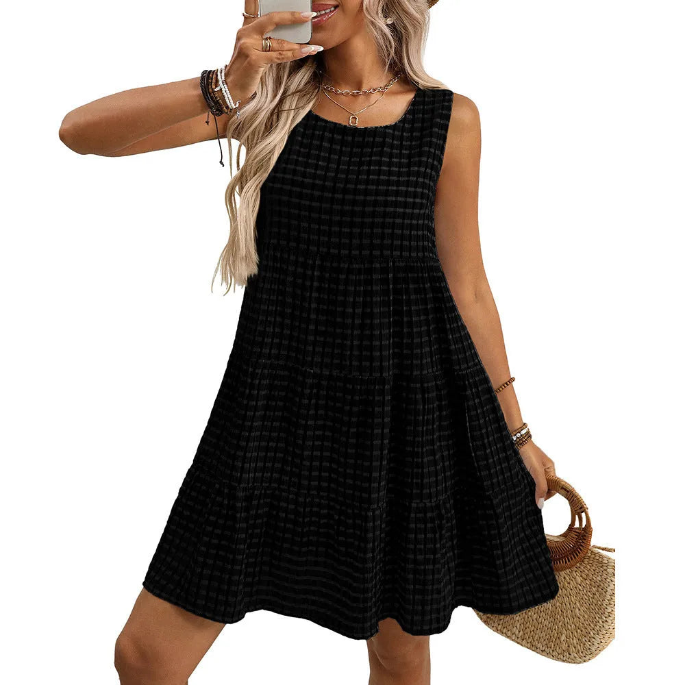 Women's sleeveless plaid dress with high waist and an oversized swing skirt in a light blue colour.
