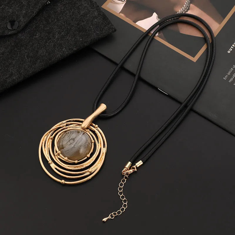 Vintage women's sweater chain necklace with large round geometric pendant in gold finish