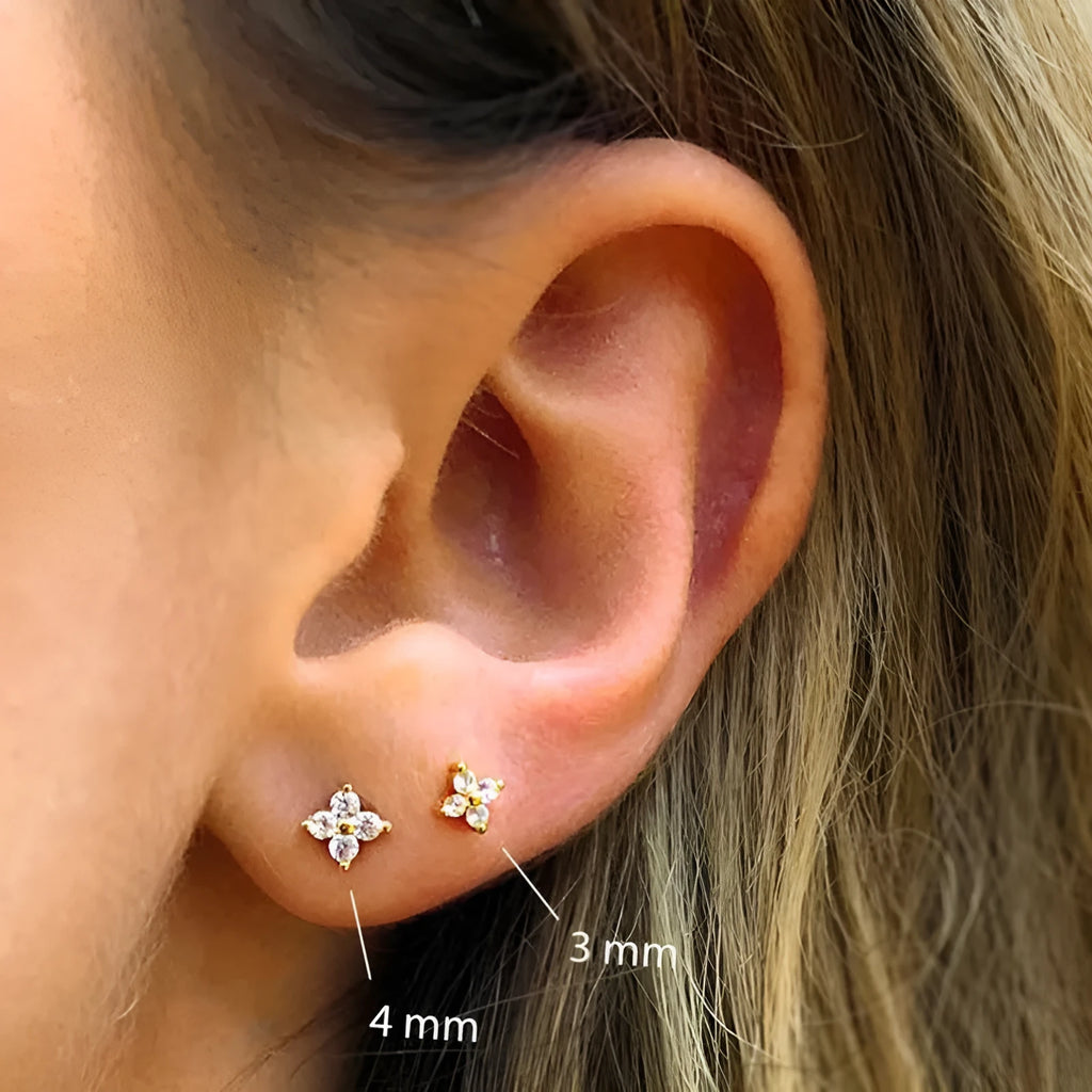S925 sterling silver geometric petal stud earrings with crystal flowers in gold or platinum plating.