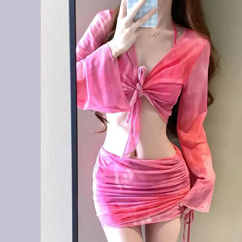 Women's blue high-waisted bikini four-piece set with shirt and skirt on a mannequin