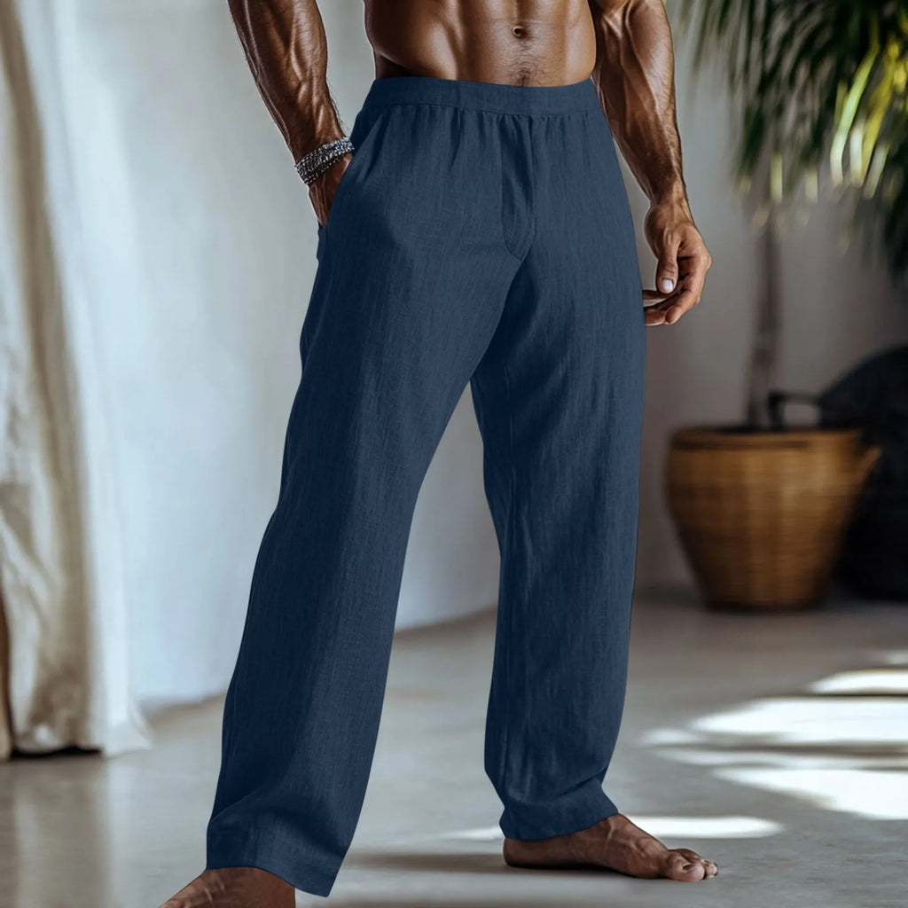 Straight-leg cotton linen trousers in light green on a hanger