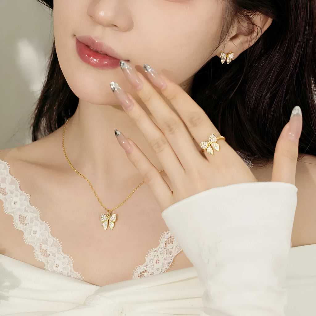 925 sterling silver bow stud earrings with zircon inlay on gold electroplated finish