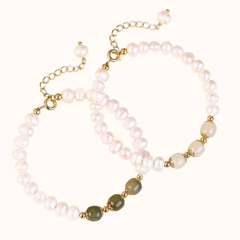 Korean style diamond-shaped freshwater pearl bracelet in Hetian jade colour on a white background.