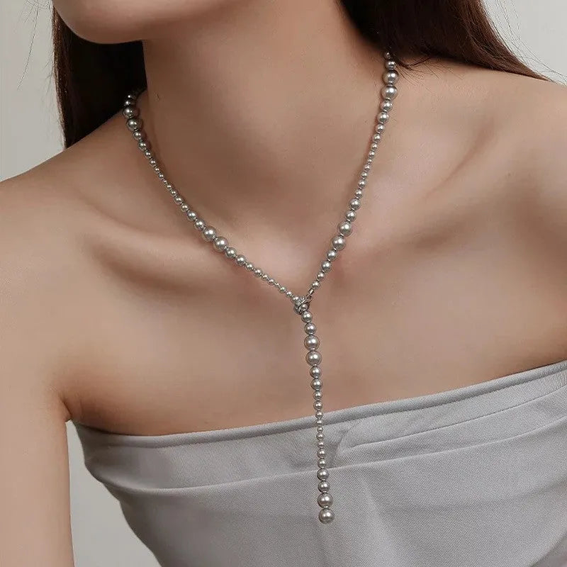 Y-shaped gradient long pearl necklace with copper geometric pendant, white and grey hues, 61-70cm chain