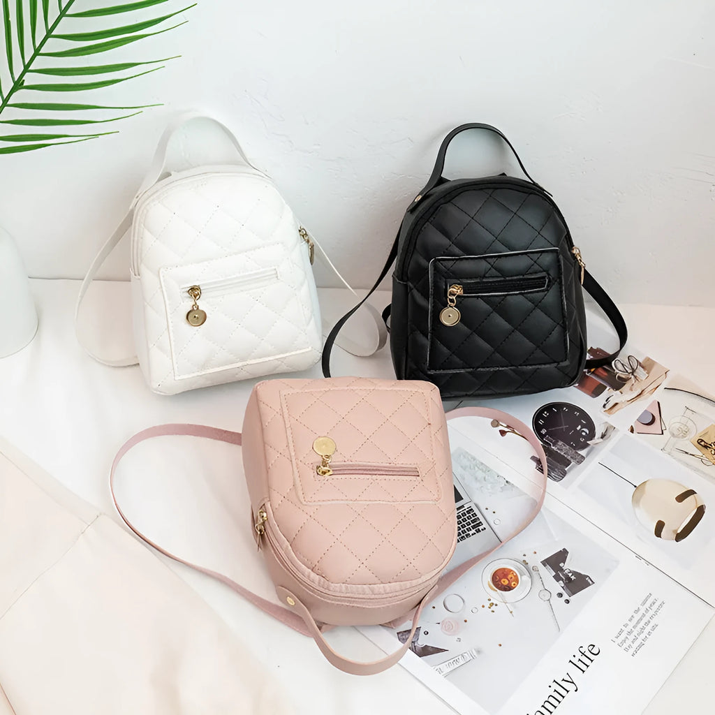 Girls' hard structured backpack with embroidery in white, black, or pink colours, showing front view and soft handle.