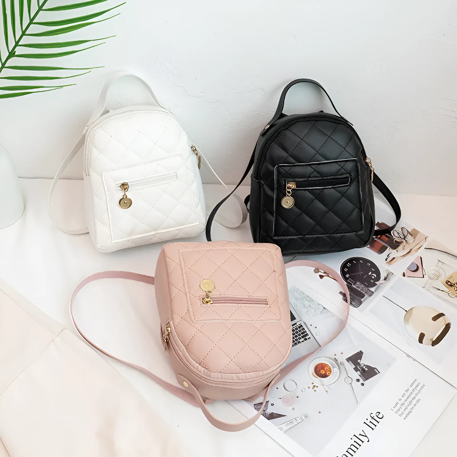 Girls' hard structured backpack with embroidery in white, black, or pink colours, showing front view and soft handle.