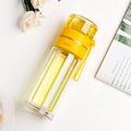 Double wall glass water bottle with tea infuser filter in green 400ml, portable rope attached