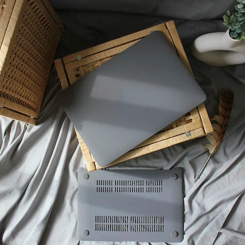 Quicksand Cobalt Gray polycarbonate protective shell for MacBook laptop on a desk
