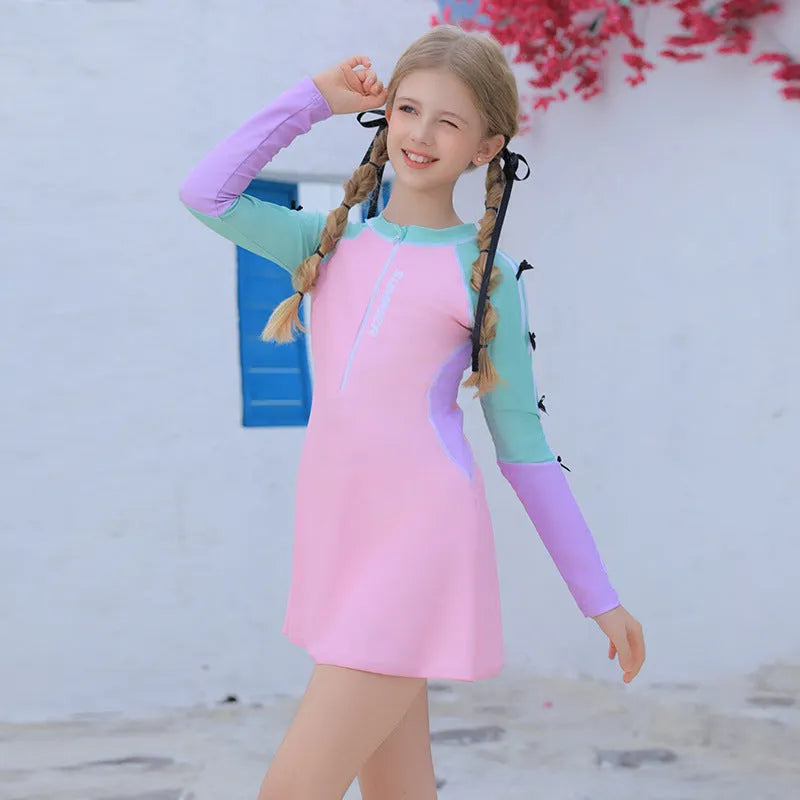 Pink polyester girls swimsuit with split skirt, sizes 3XL to 7XL, conservative children's swimwear