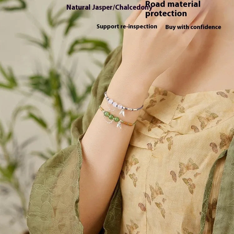 Women's diamond shape Hetian jade bracelet with woven carrying strap in light green or haze blue