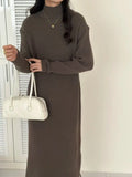 Women's beige half-turtleneck long sleeve knitted dress with a high waist and knee-length skirt.