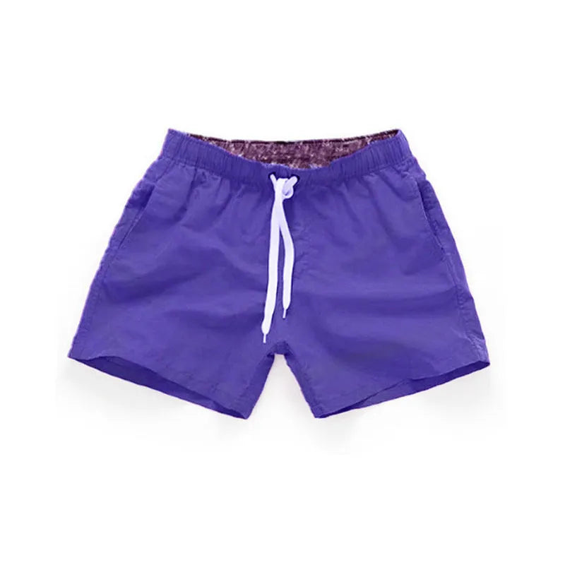 Men's straight-leg beach shorts in polyester fabric, shown in multiple colour options.