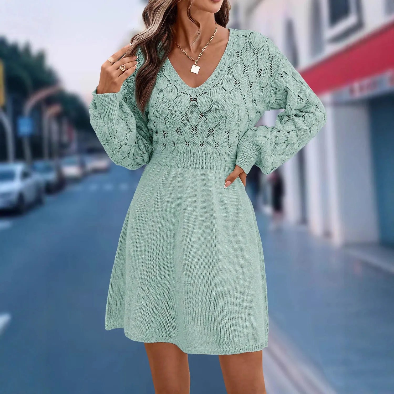 Women's long sleeve apricot V-neck dress with high waist and 3D pattern detail.