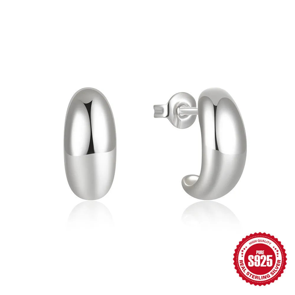 C-shaped sterling silver stud earrings with electroplated gold finish and post backing