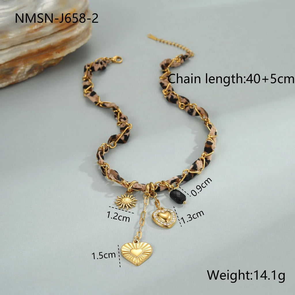 Geometric leopard love pendant necklace on a stainless steel chain with 18K gold electroplate.
