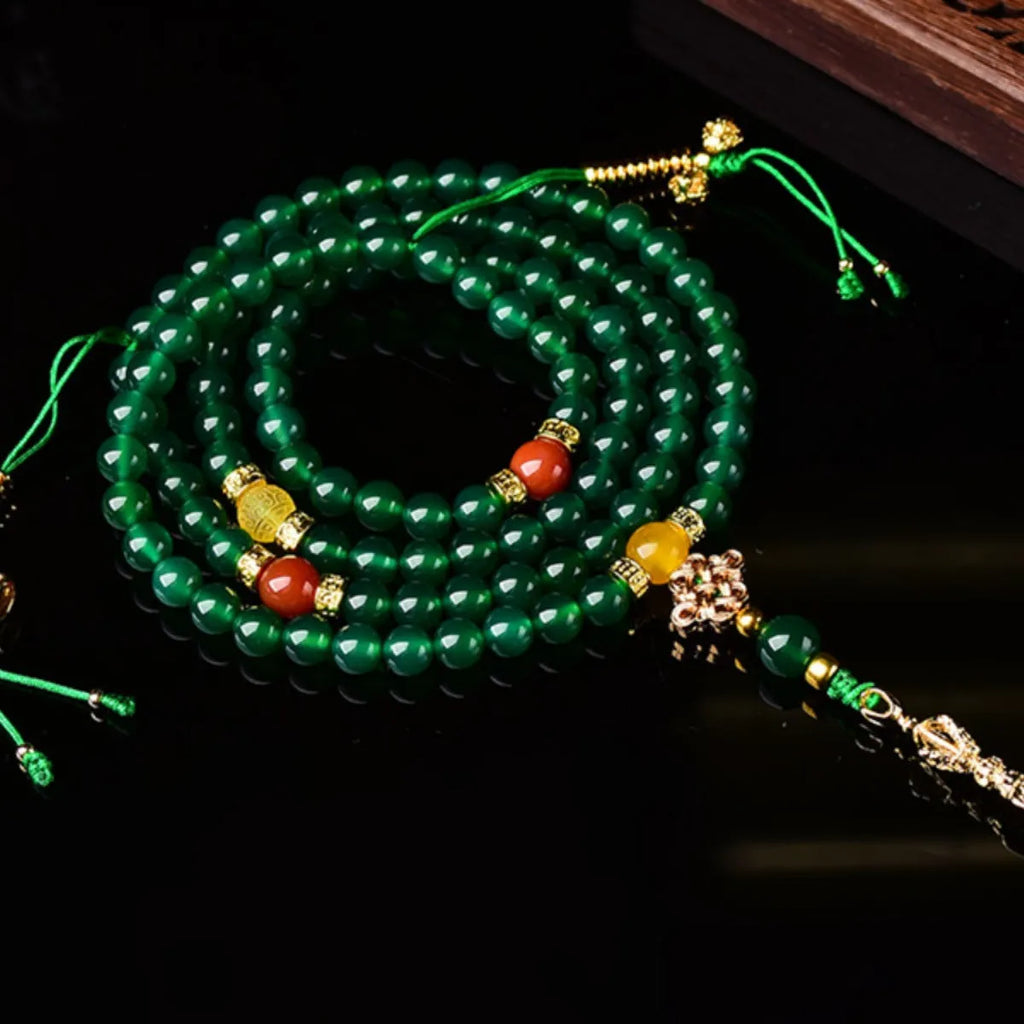 Natural green agate multi-circle bracelet for men and women on a wrist, showing different bead size options.