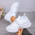 Women's slip-on breathable mesh wedge sneakers in pink with rhinestone accents and wedge heel