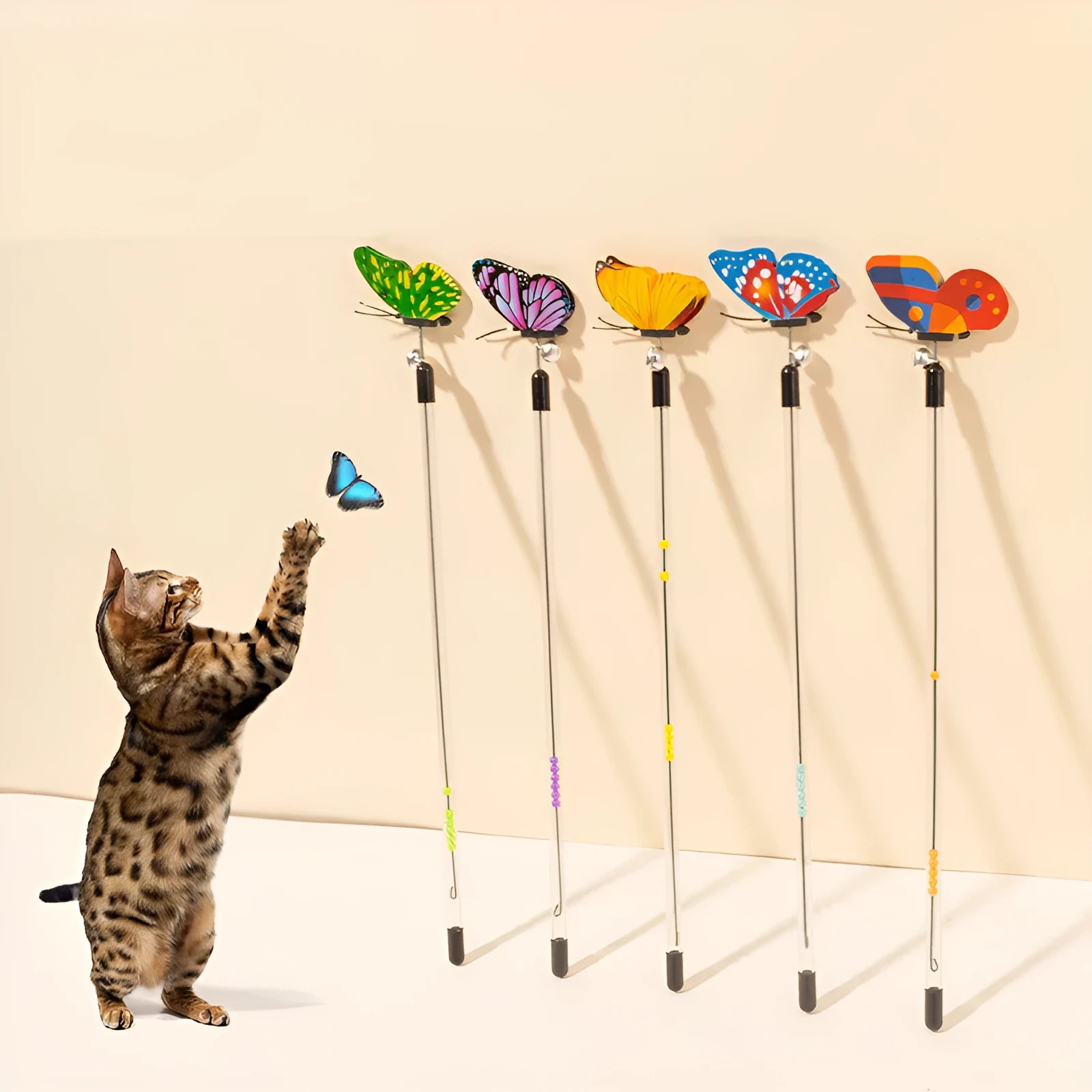 Retractable cat teasing stick with spring butterfly attachment in mixed hair colours, full length 30-50cm on a light background