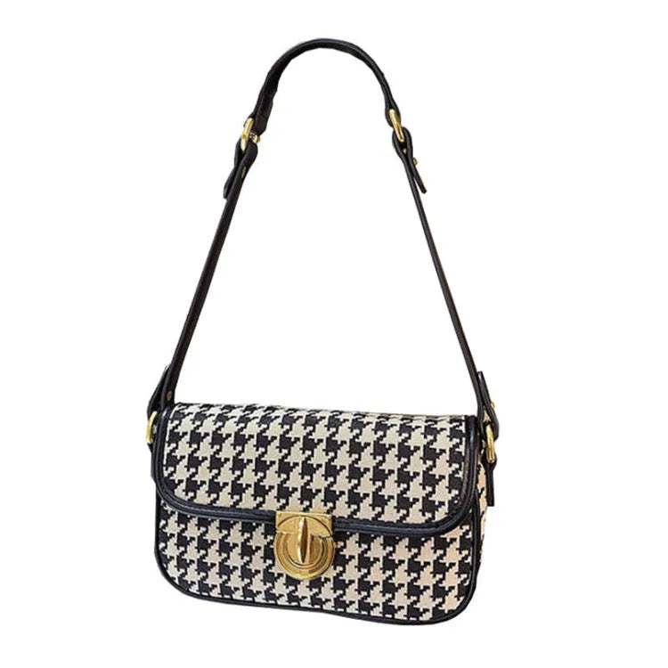 Women's houndstooth canvas baguette shoulder bag with adjustable strap on model