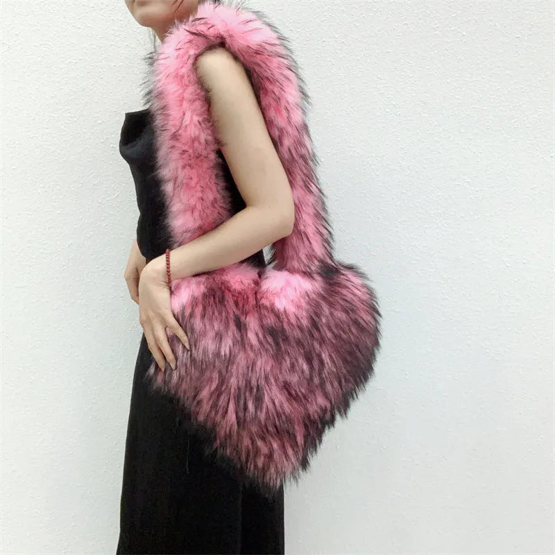 Women winter fleece heart shape crossbody bag with plush exterior, tassel detail, and large capacity