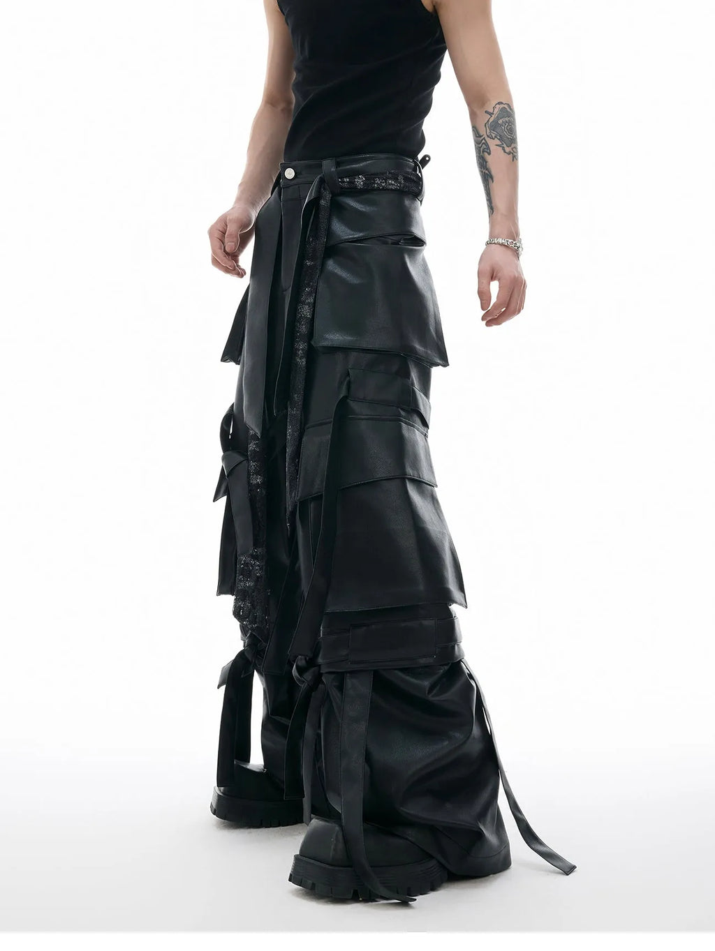 Black retro loose-fit trousers with multiple pockets and quilted leather-look fabric.
