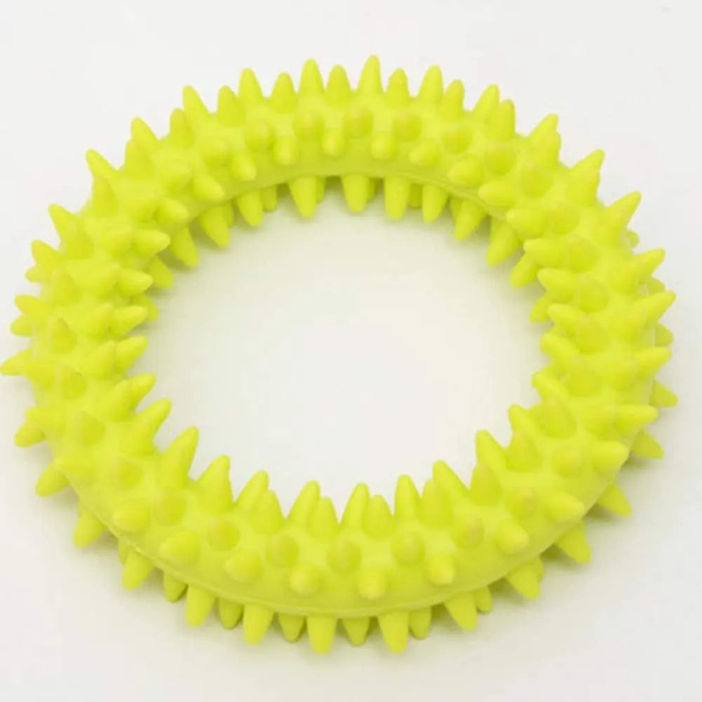 Blue TPR spiky ring dog chew toy for dental cleaning and bite training on a white background.