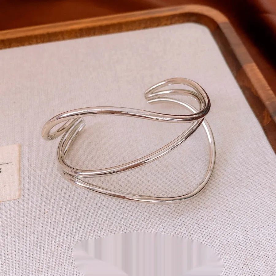 Geometric irregular lines open-ended metal bracelet in gold or silver with round popular element