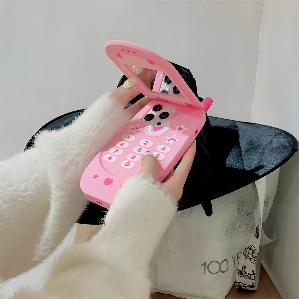 Pink silicone flip phone case with mirror for iPhone models.