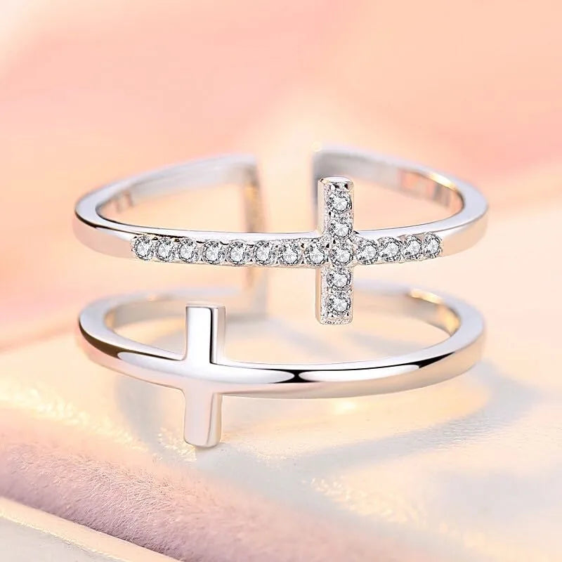 Adjustable copper ring with sterling silver inlay and white gold finish, featuring a zircon stone.