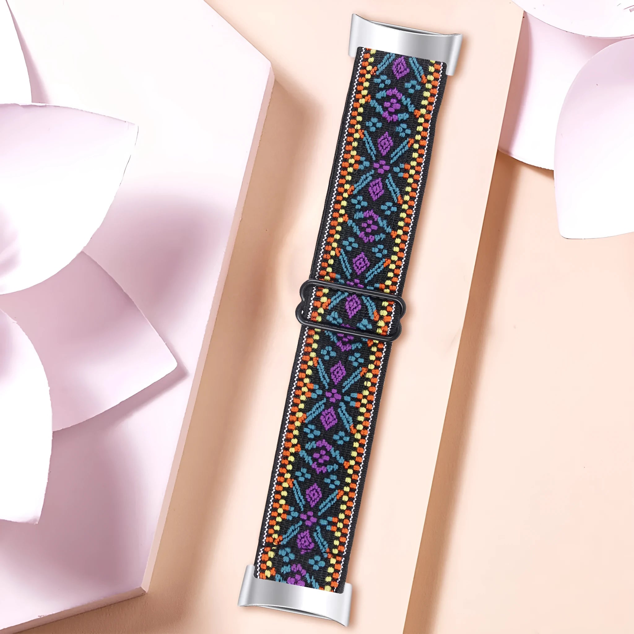 Printed elastic watch strap for Fitbit Charge 6 showing adjustable fit and colour options