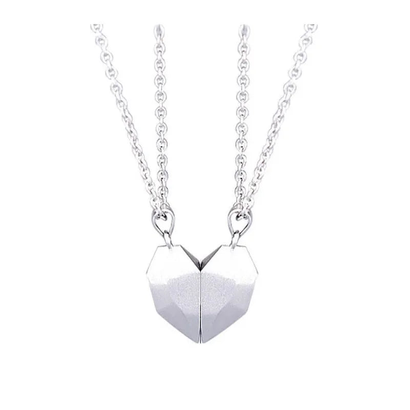 Minimalist magnetic heart pendant couple necklace with gold-plated finish, black and white colours, on adjustable 62cm chain