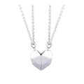 Minimalist magnetic heart pendant couple necklace with gold-plated finish, black and white colours, on adjustable 62cm chain