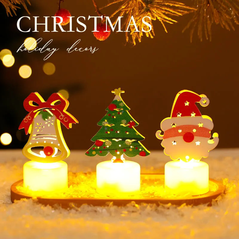 Assorted LED electronic candles featuring Christmas tree, Santa Claus, and snowman designs on a table
