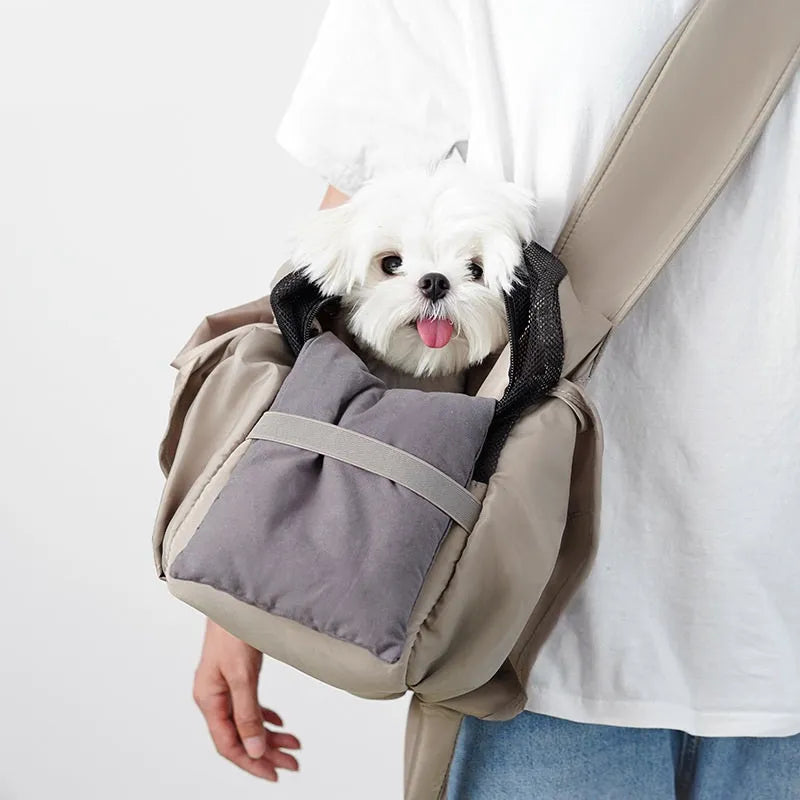 Apricot coloured cloth pet handbag carrier for cats or small dogs.