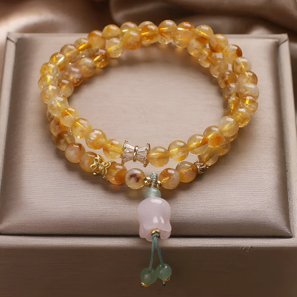 Women's crystal bracelet with natural gold rutilated quartz yellow tower double ring Lily pendant, pearl and rhinestone accents, 34cm length