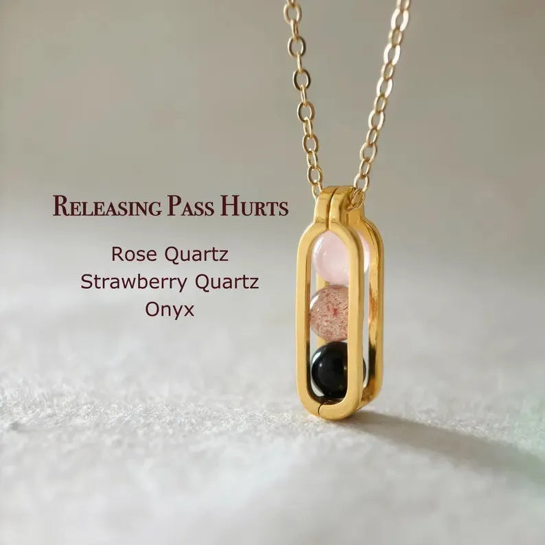 Minority simple pearl necklace with gold titanium steel chain and inlaid pearl pendant on plain background