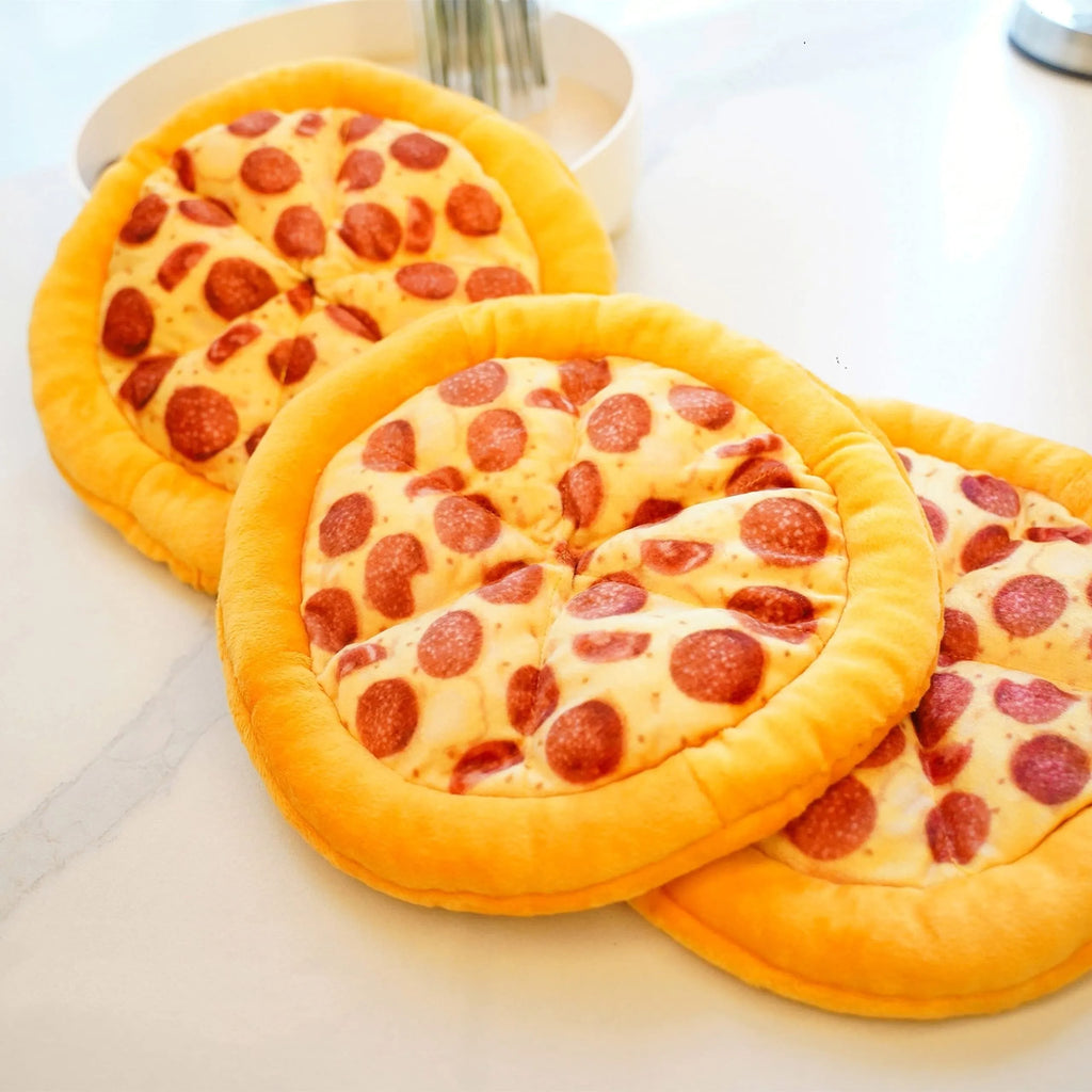 Yellow pizza slice plush dog chew toy with textured grinding surface