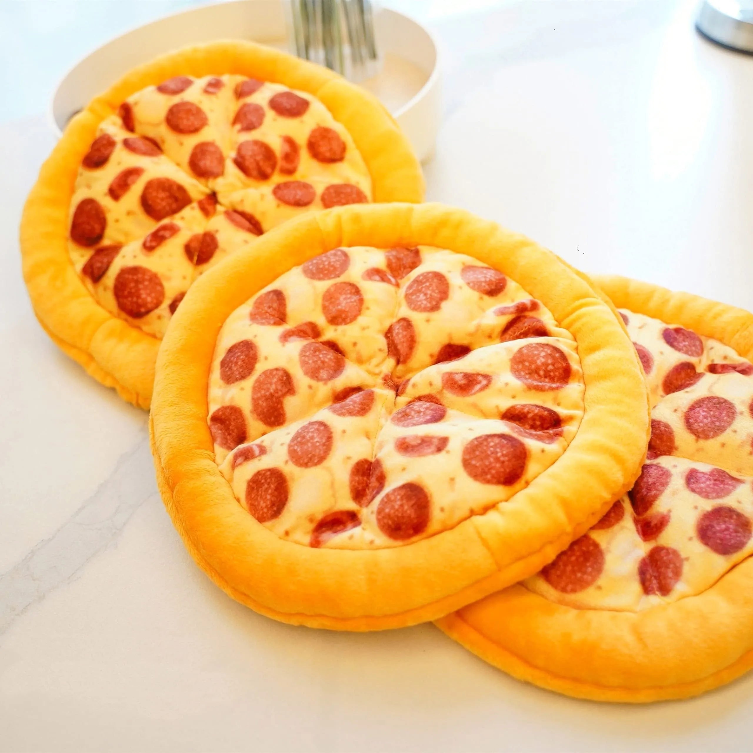 Yellow pizza slice plush dog chew toy with textured grinding surface