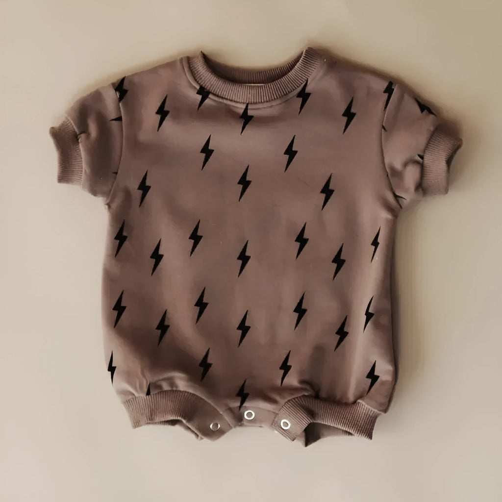 Printed triangle baby romper in cotton wool pull frame fabric with long sleeves and ribbed hem